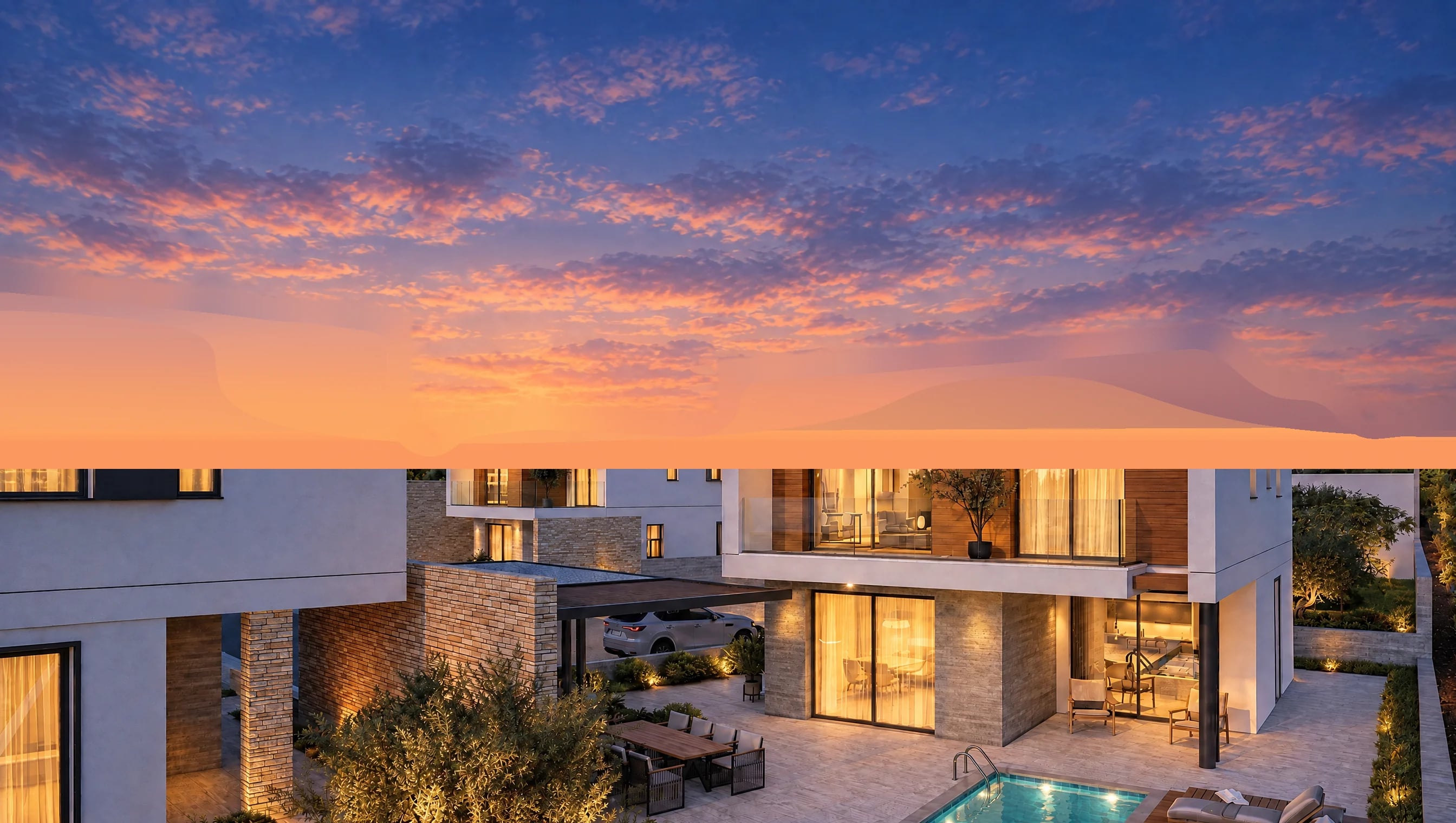Aurelia Homes, Tala — a villa in the evening: lit windows, timber cladding on the upper floor, a dining terrace and an olive tree in the garden (visualisation)